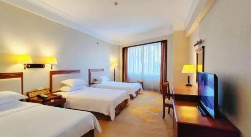 Bed in Fangzhong Holiday Hotel