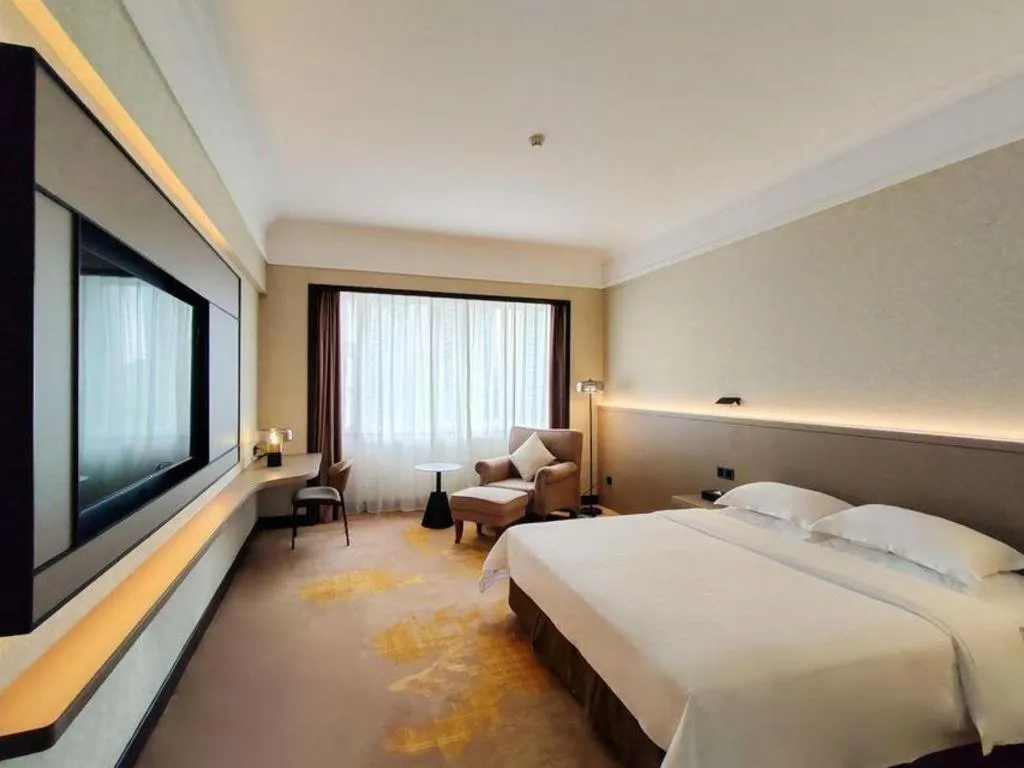 Bed in Fangzhong Holiday Hotel