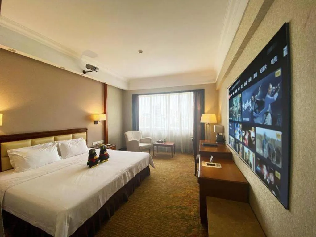 Bed in Fangzhong Holiday Hotel