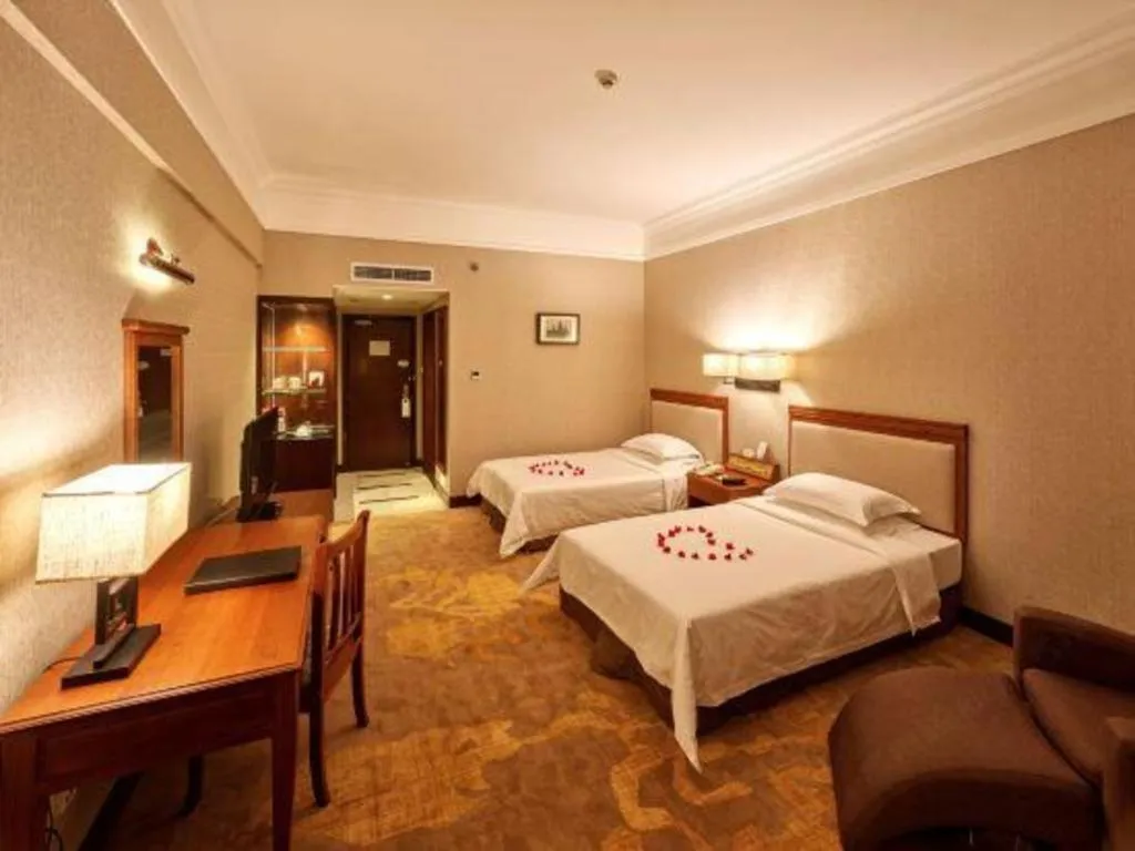 Bed in Fangzhong Holiday Hotel