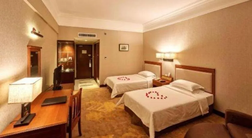 Bed in Fangzhong Holiday Hotel