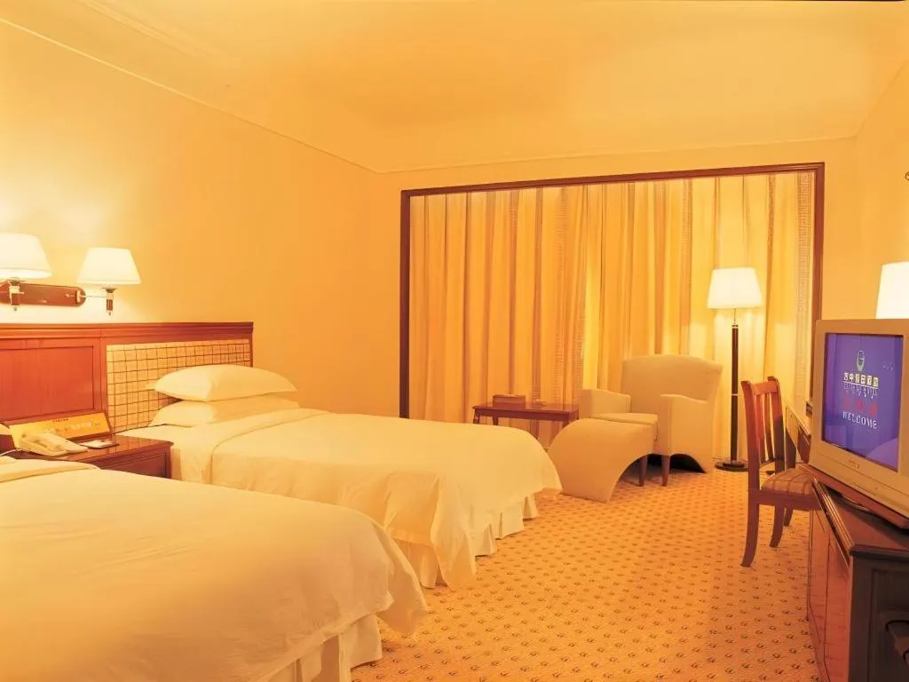 Bed in Fangzhong Holiday Hotel