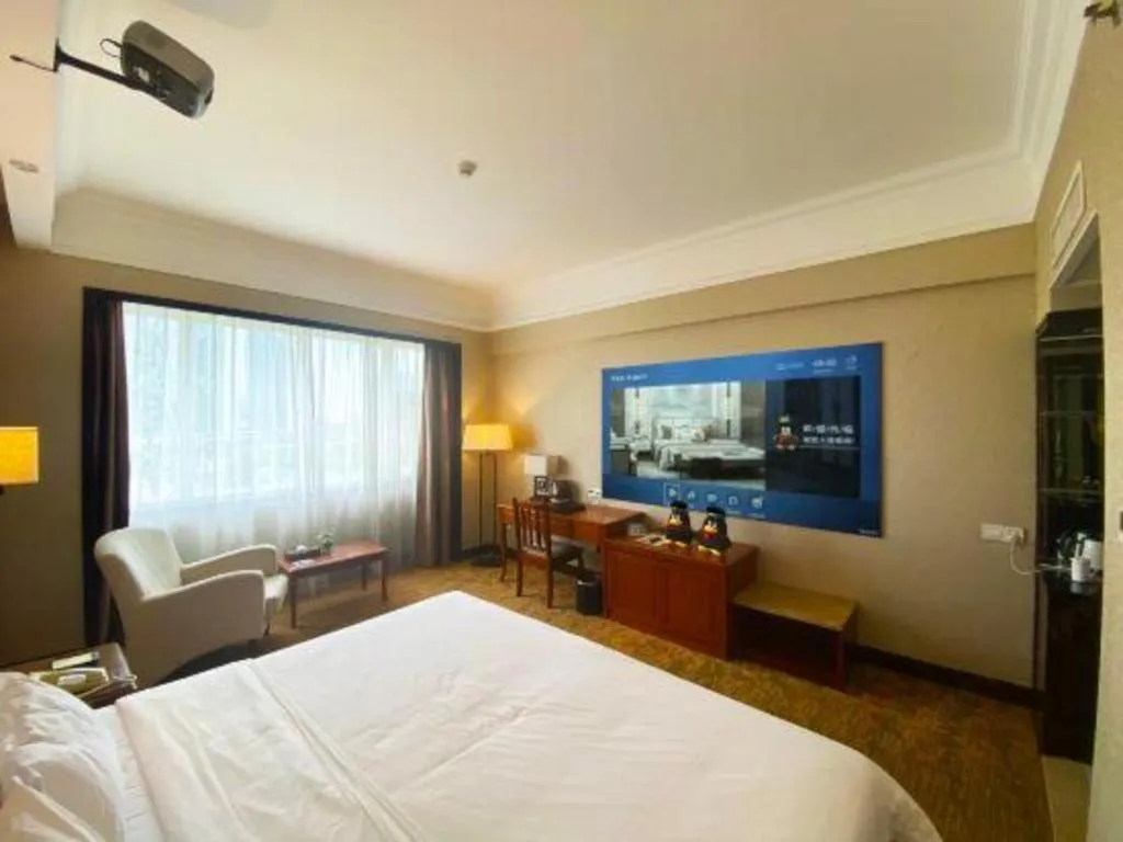 Bed in Fangzhong Holiday Hotel