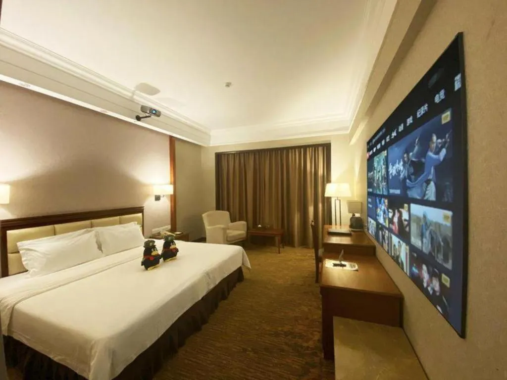 Bed in Fangzhong Holiday Hotel