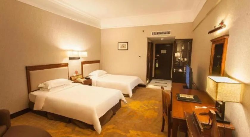 Bed in Fangzhong Holiday Hotel