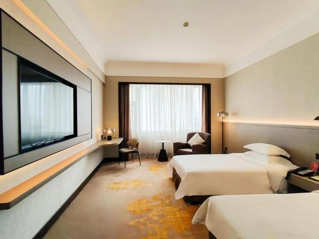 Bed in Fangzhong Holiday Hotel