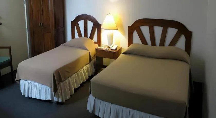 Bed in Adriatico Arms Hotel