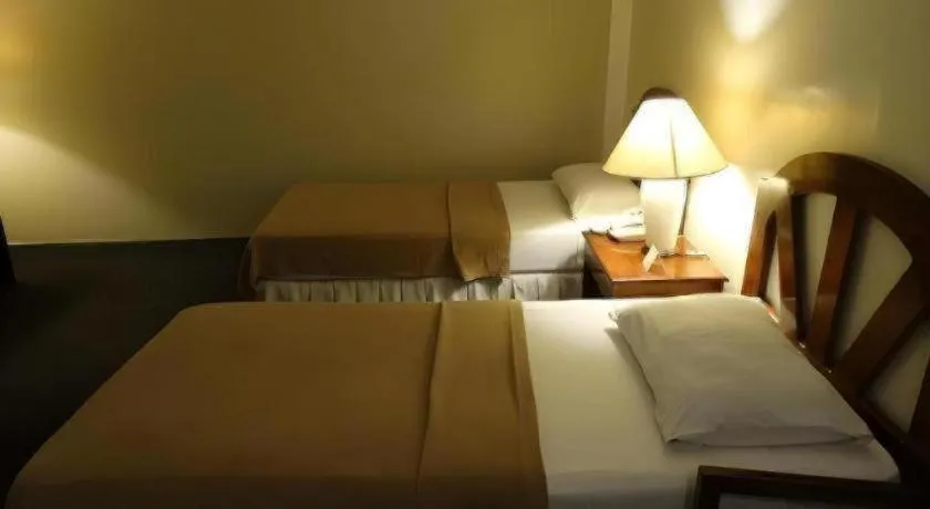 Bed in Adriatico Arms Hotel