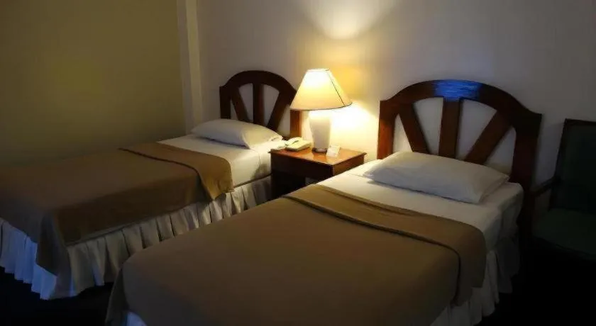 Bed in Adriatico Arms Hotel