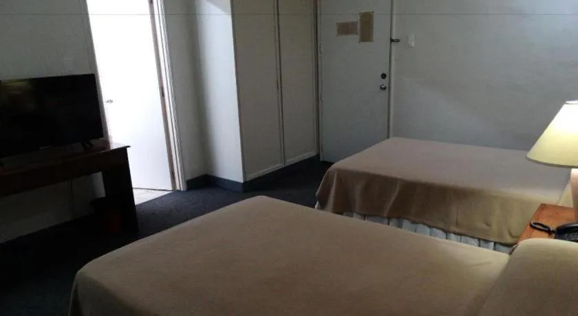 Bed in Adriatico Arms Hotel