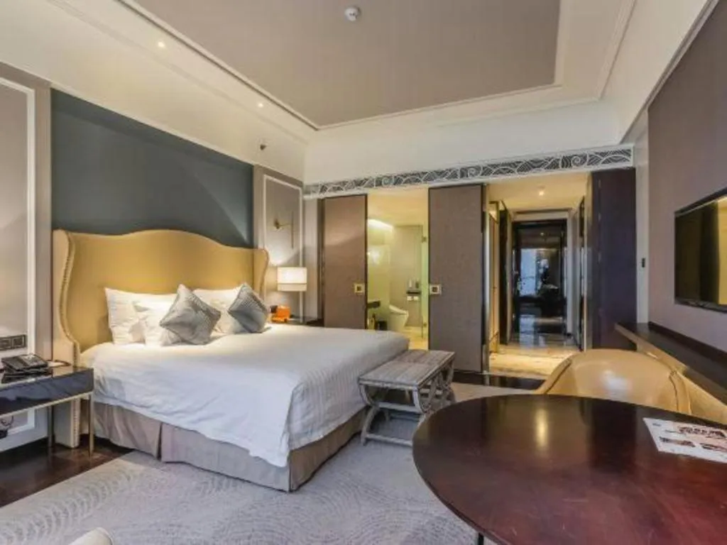 Bed in Grand New Century Hotel Yixing
