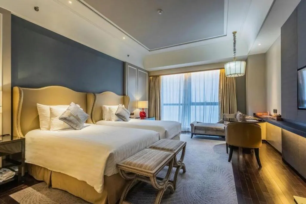 Bed in Grand New Century Hotel Yixing