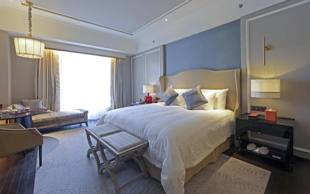 Bed in Grand New Century Hotel Yixing