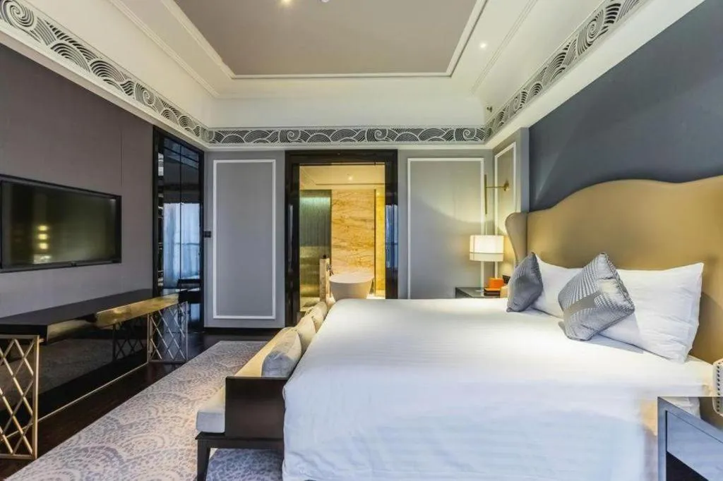 Bed in Grand New Century Hotel Yixing