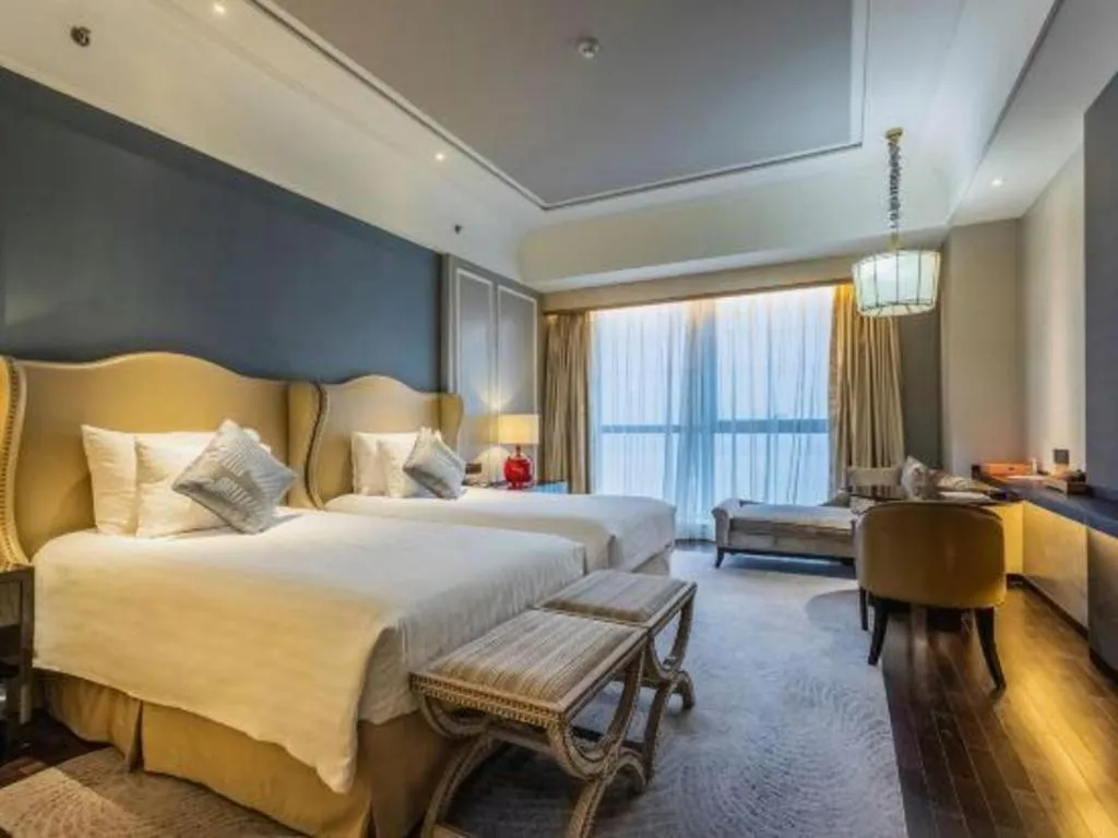 Bed in Grand New Century Hotel Yixing