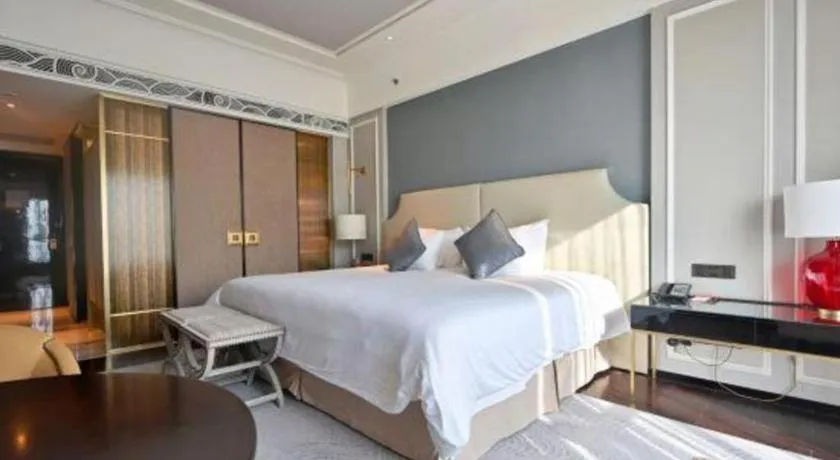 Bed in Grand New Century Hotel Yixing