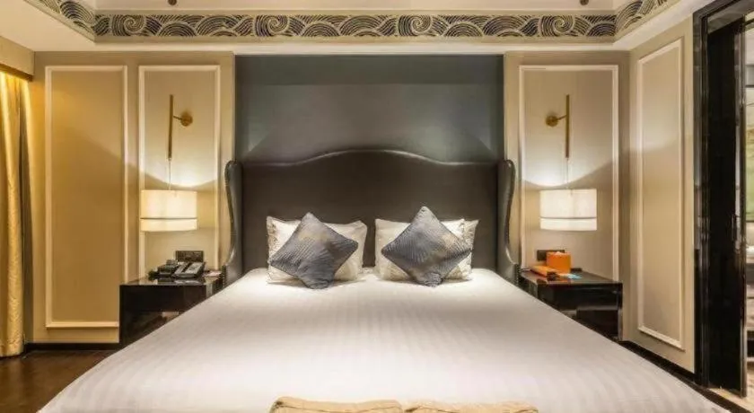 Bed in Grand New Century Hotel Yixing