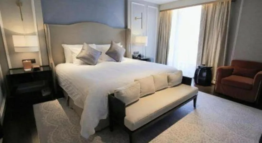 Bed in Grand New Century Hotel Yixing