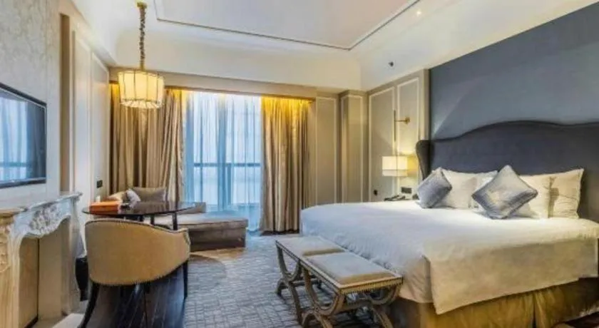 Bed in Grand New Century Hotel Yixing