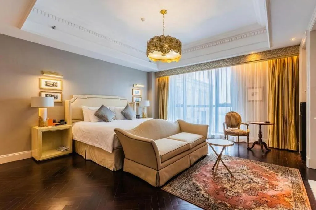 Bed in Grand New Century Hotel Yixing
