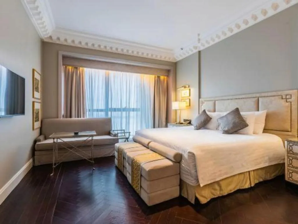 Bed in Grand New Century Hotel Yixing
