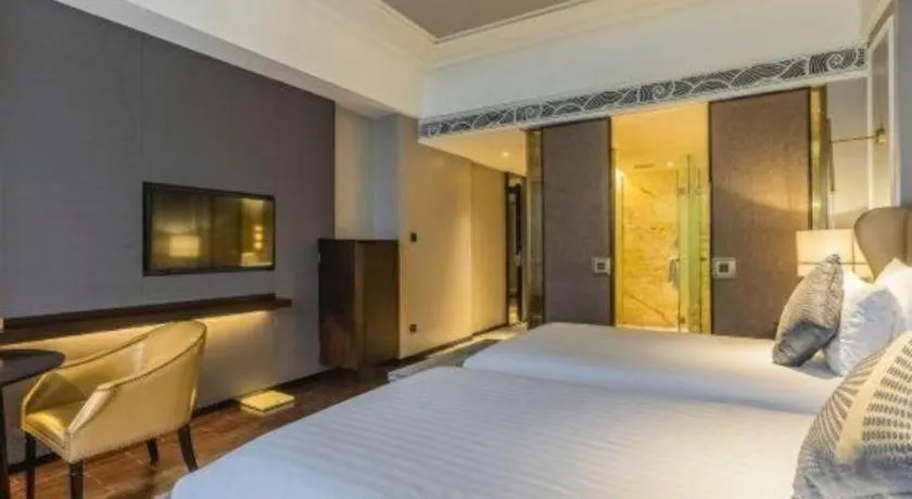 Bed in Grand New Century Hotel Yixing