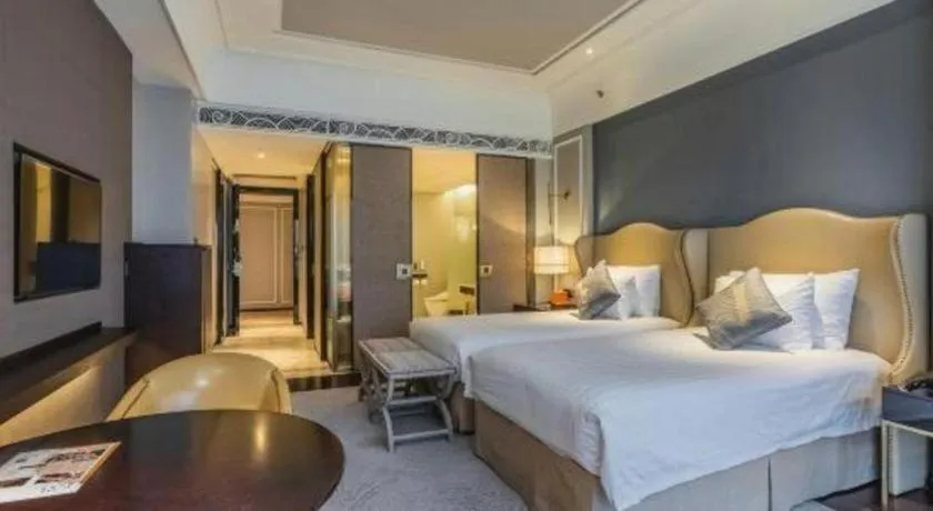 Bed in Grand New Century Hotel Yixing