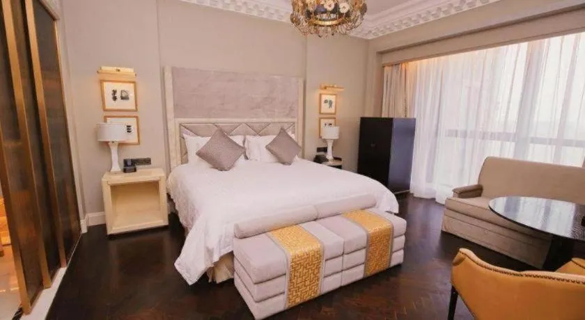 Bed in Grand New Century Hotel Yixing