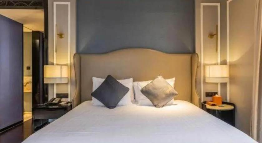 Bed in Grand New Century Hotel Yixing