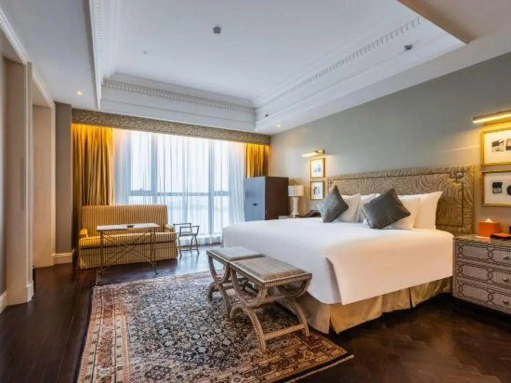Bed in Grand New Century Hotel Yixing