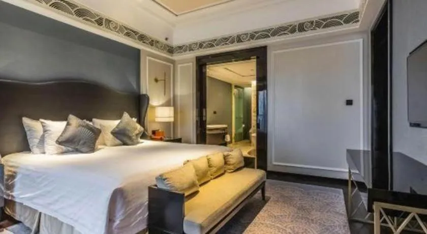 Bed in Grand New Century Hotel Yixing