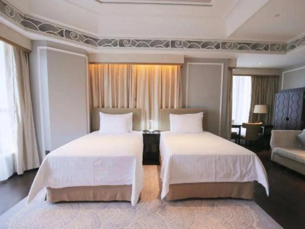 Bed in Grand New Century Hotel Yixing