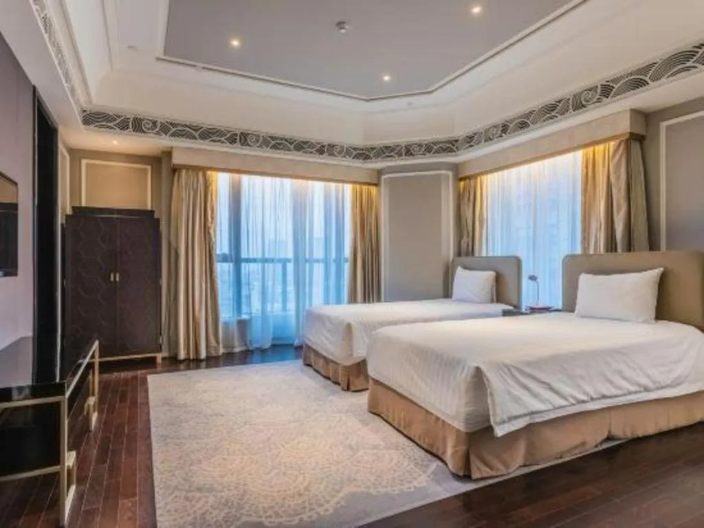 Bed in Grand New Century Hotel Yixing