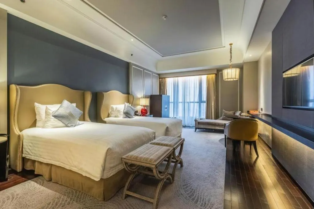 Bed in Grand New Century Hotel Yixing