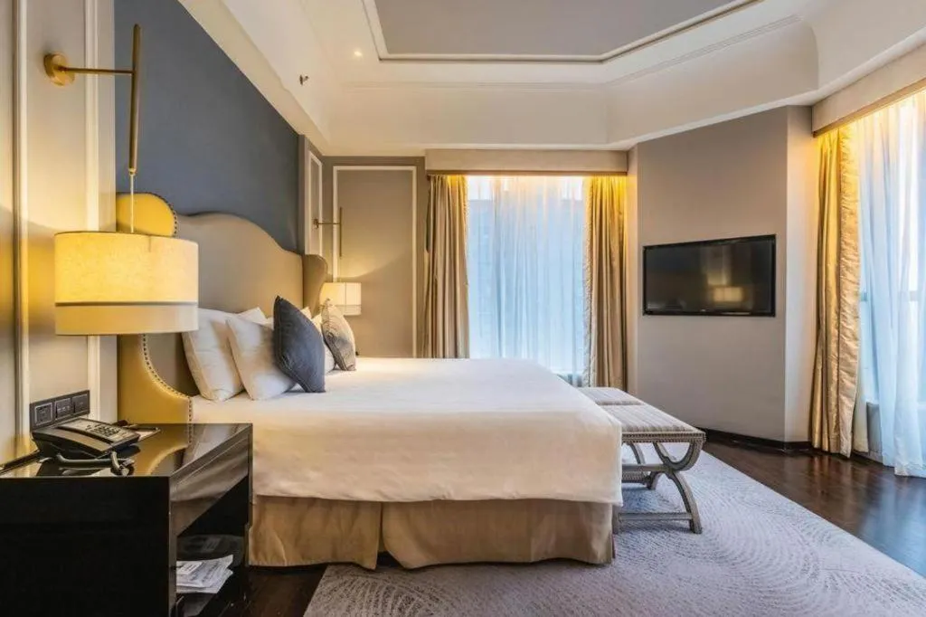 Bed in Grand New Century Hotel Yixing
