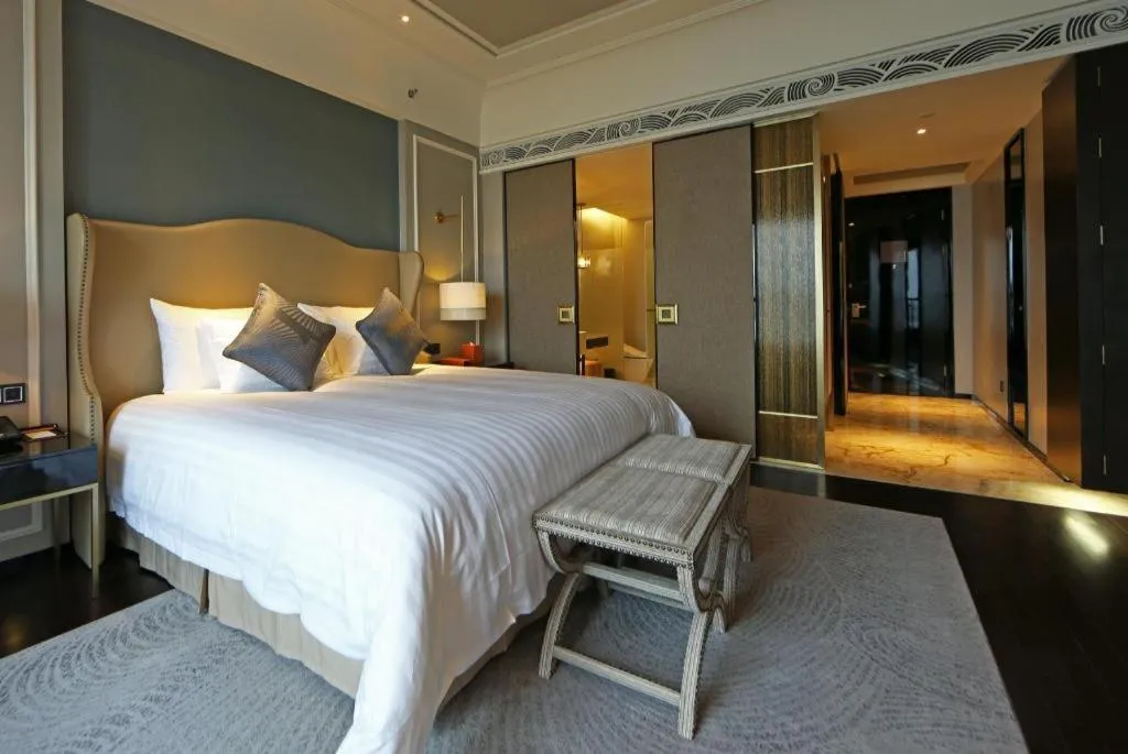 Bed in Grand New Century Hotel Yixing