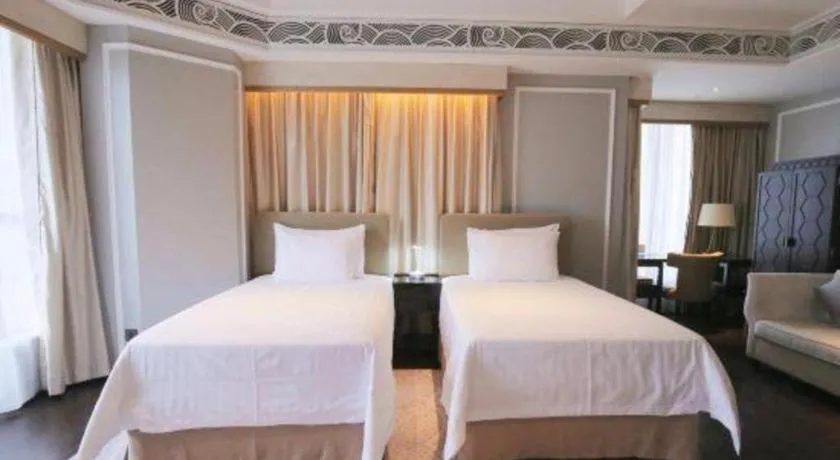 Bed in Grand New Century Hotel Yixing