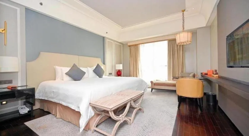 Bed in Grand New Century Hotel Yixing