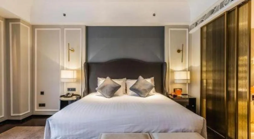 Bed in Grand New Century Hotel Yixing