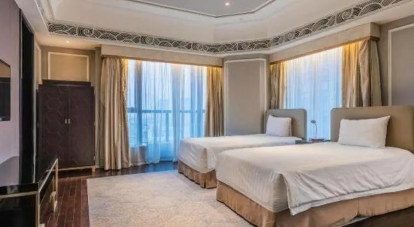 Bed in Grand New Century Hotel Yixing