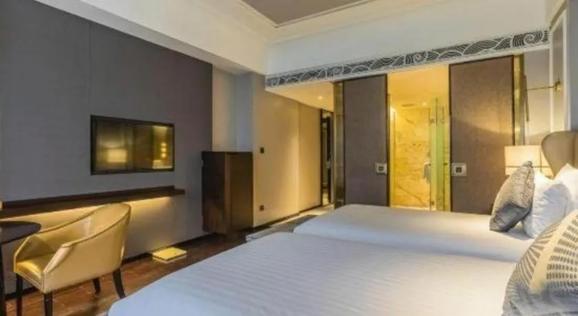 Bed in Grand New Century Hotel Yixing