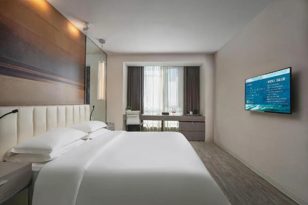 Bed in Jinjiang Metropolo Hotel Hangzhou Xiasha Jinsha Lake