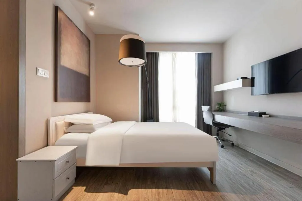 Bed in Jinjiang Metropolo Hotel Hangzhou Xiasha Jinsha Lake