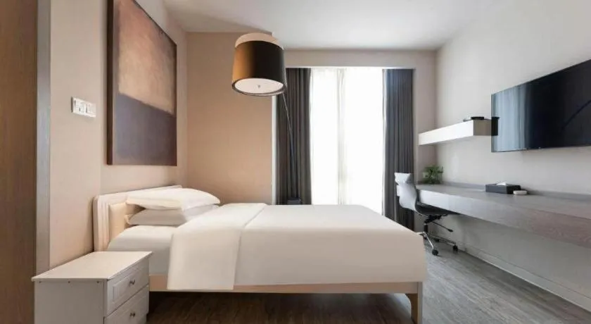 Bed in Jinjiang Metropolo Hotel Hangzhou Xiasha Jinsha Lake