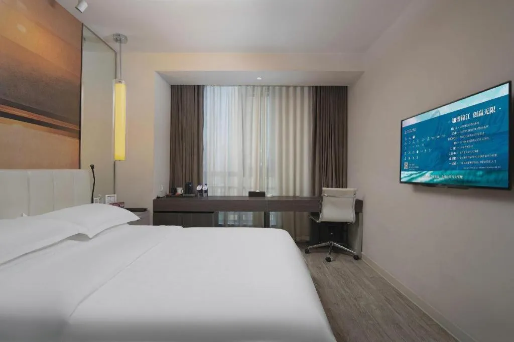 Bed in Jinjiang Metropolo Hotel Hangzhou Xiasha Jinsha Lake