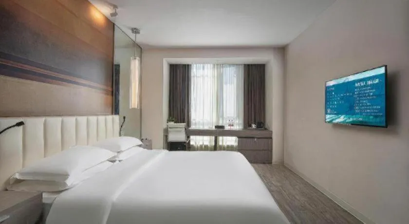 Bed in Jinjiang Metropolo Hotel Hangzhou Xiasha Jinsha Lake