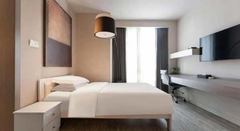 Bed in Jinjiang Metropolo Hotel Hangzhou Xiasha Jinsha Lake