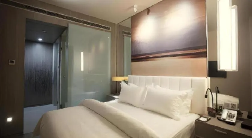 Bed in Jinjiang Metropolo Hotel Hangzhou Xiasha Jinsha Lake