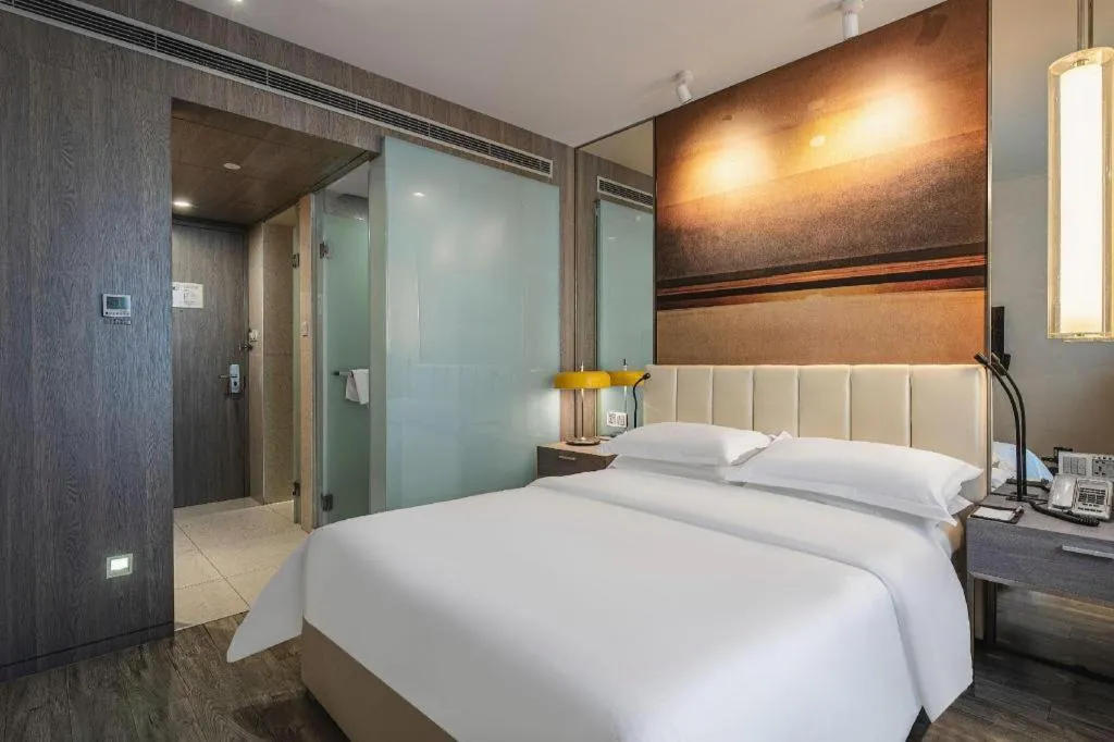 Bed in Jinjiang Metropolo Hotel Hangzhou Xiasha Jinsha Lake