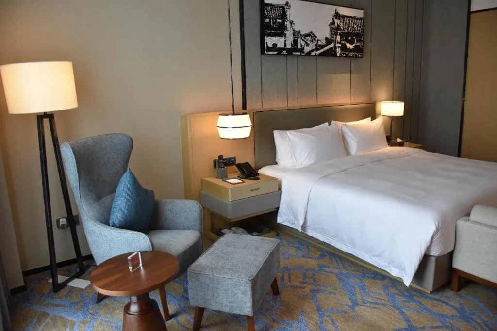 Bed in Zhuhai Tangyi Hotel